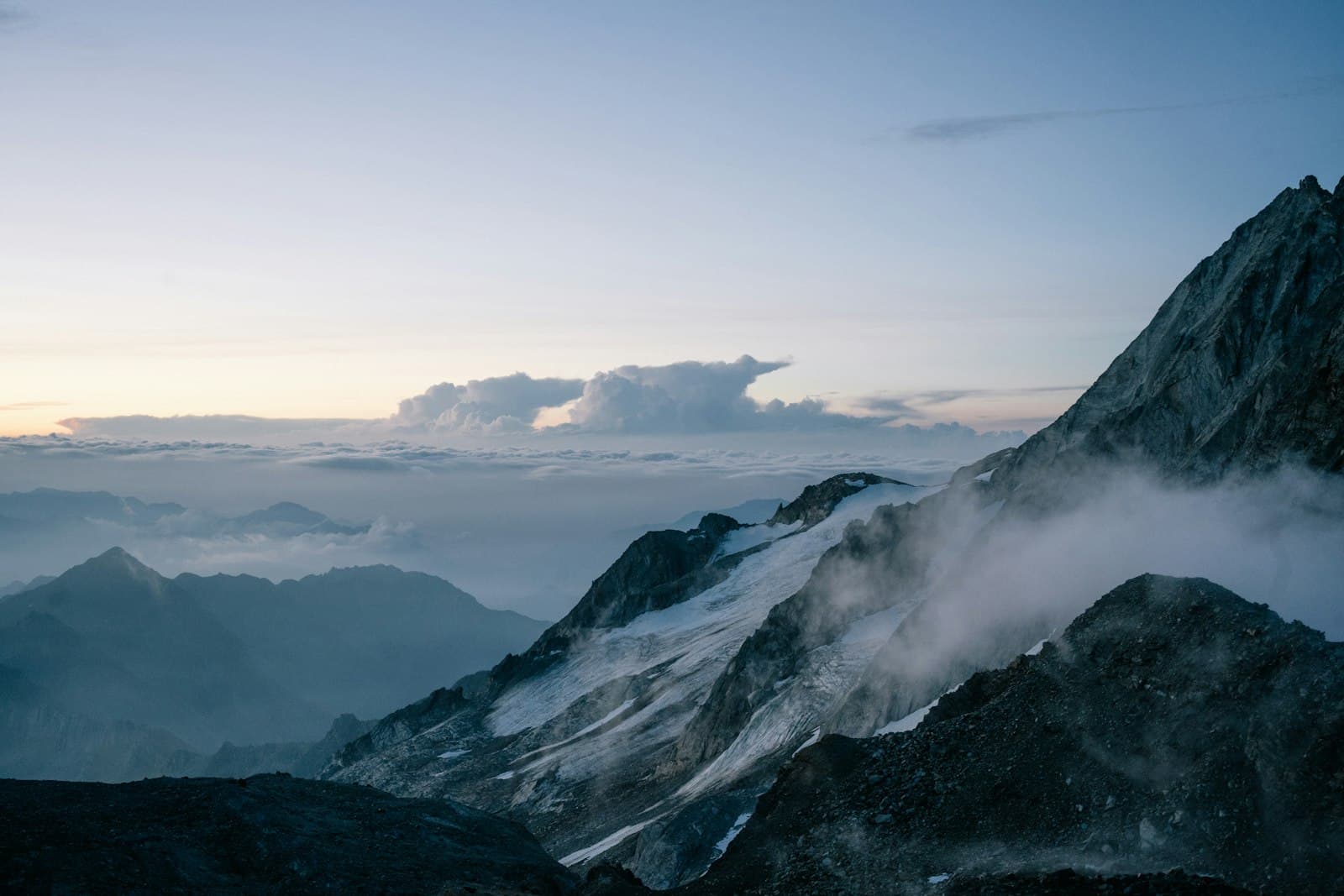 A mountain summit above the clouds at dawn — the covenant renewed