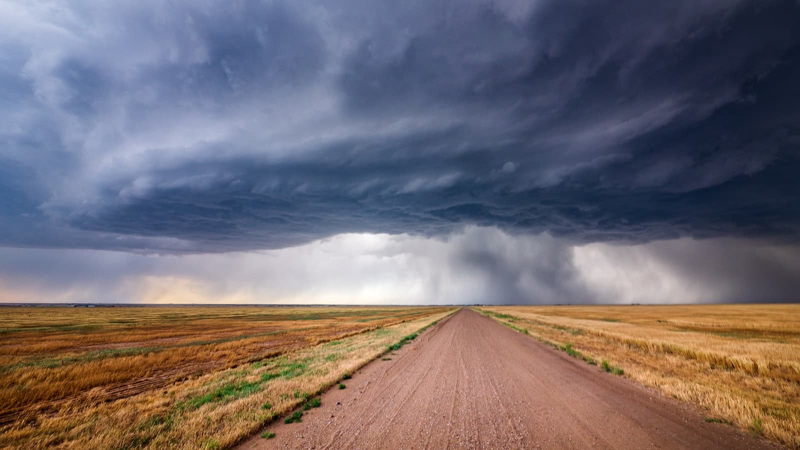 A vast storm front over an empty plain — visions of glory