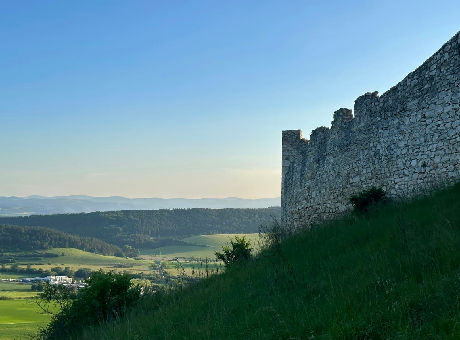 An ancient rampart above a wide valley — waiting on the Lord in faith