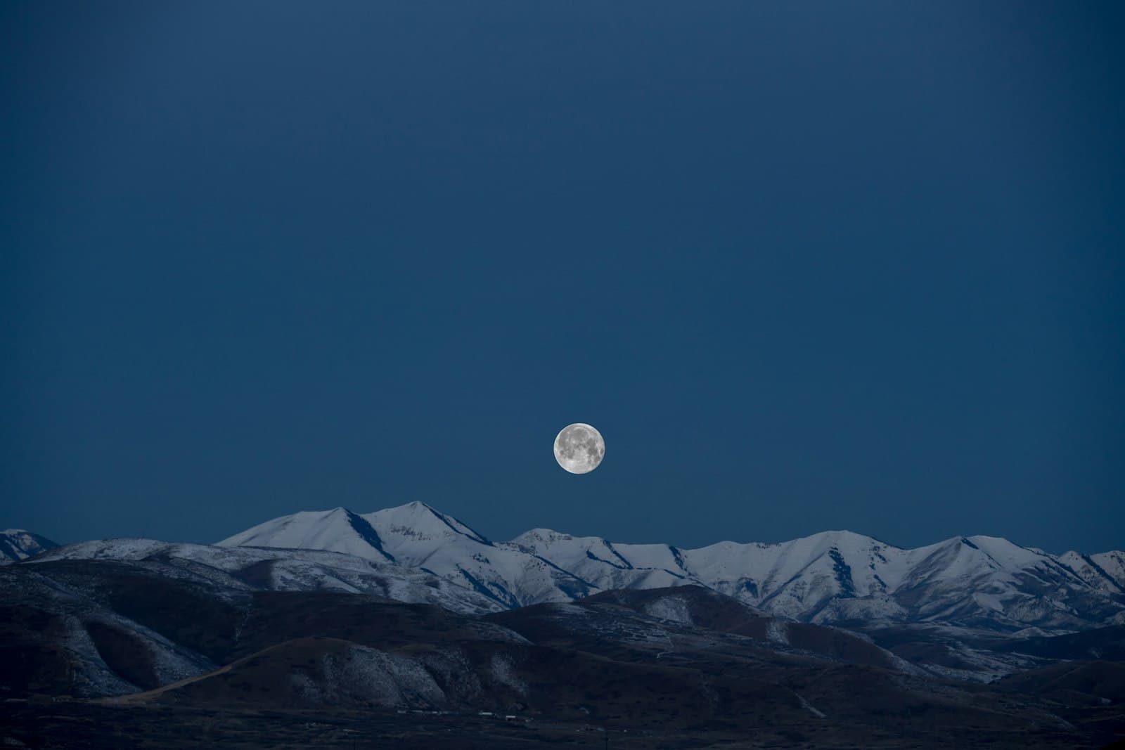 A moonlit snow ridge under deep blue — visions and the coming King